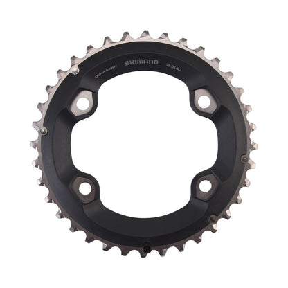 Plato exterior SHIMANO SLX M7000 de 11 velocidades para doble plato, 4 orificios, 96 mm — vista del plato sobre fondo blanco