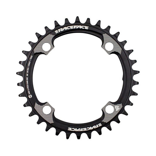 Plato único RACE FACE compatible con Shimano de 12 velocidades, 4 tornillos, 104 mm, negro — vista del plato sobre fondo blanco