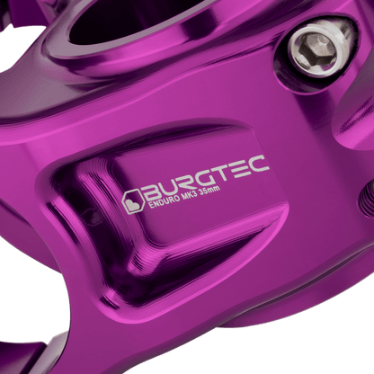 Potencia BURGTEC ENDURO MK3 violeta — detalle del cuerpo mecanizado
