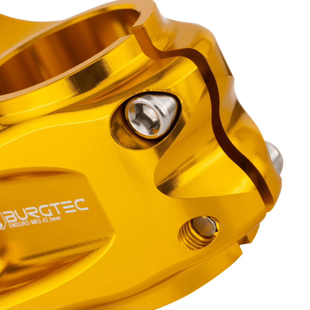 Potencia BURGTEC ENDURO MK3 dorada — detalle de la sujeción del tubo de dirección